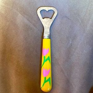 Decorative bottle opener with pink tulip on a yellow background